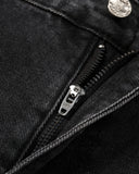 zipper fly detail on black washed jeans