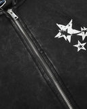 close-up of studded star graphic and zipper detail