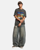 model standing front view in retro graphic oversized t shirt