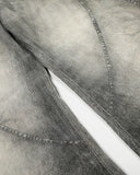 curved seam detail on grey barrel jeans