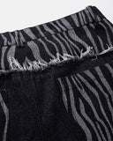 raw edge waist seam detail on patchwork jeans