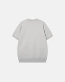 side view of cream knit pullover with dropped shoulders