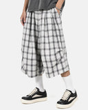 model styling plaid shorts casual outfit