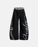 black barrel sweatpants with contrast side stripes