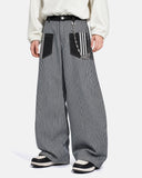 model wearing striped baggy jeans