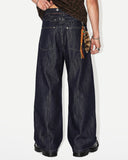 model wearing cinch back raw baggy jeans back view