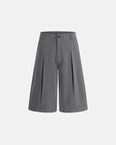 inflation pleated stud detail tailored shorts front view