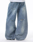 faded light wash denim with distressed details