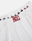 star waistband and logo patch detail on white sweatpants