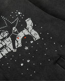 close-up of crystal studs and metallic graphic details