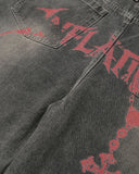 red gothic graphic detail on washed denim