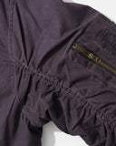 ruched sleeve and utility zip pocket detail close-up