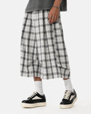 flat lay of grey white plaid cropped shorts