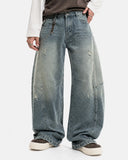 model wearing deconstructed barrel jeans