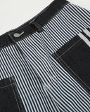 dark waistband detail on striped jeans