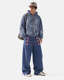 model front view in blue button detail wide leg sweatpants