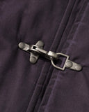 metal clasp hardware detail on washed bomber jacket close-up