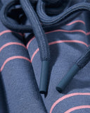 elastic waistband and drawstring detail on blue sweatpants