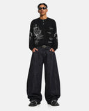 model full body outfit in black graphic henley long sleeve t shirt