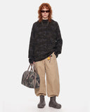 full body outfit with black camo hoodie and tan pants