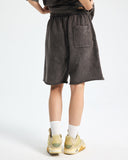 Back view of washed sweat shorts with elastic waistband