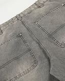 back pocket construction detail on grey washed jeans