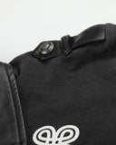 buttoned shoulder epaulette detail on long sleeve polo