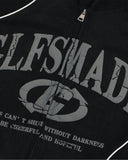 close-up of puff print front graphic on black hoodie