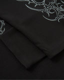 black rib cuff detail on layered polo shirt