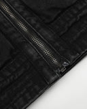 black denim jacket zipper and hem detail close-up