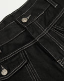 contrast stitch detail on black jeans