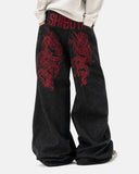 model wearing wide leg washed denim jeans full body