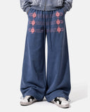 model wearing blue button detail wide leg sweatpants front crop