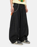 curved seam detail on black denim pants