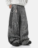 model wearing grey leopard barrel jeans front detail