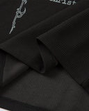 waffle fabric texture close up on black polo shirt
