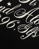 star and distressed lettering detail on black graphic tee