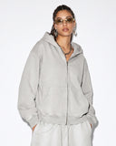 model wearing light grey acid washed zip hoodie