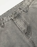 waistband and curved seam detail on deconstructed jeans
