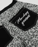 back patch pocket detail on leopard barrel jeans