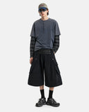 model wearing black cargo shorts with washed tees styling