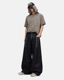full-body styling with black eyelet baggy jeans