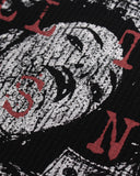 lower distressed collage print detail on black waffle t shirt