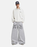 full-body outfit with grey star graphic barrel sweatpants