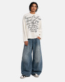 full body outfit with apricot waffle graphic t shirt and wide leg jeans