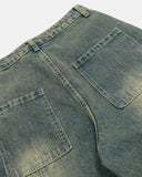 back pocket detail on dirty blue barrel jeans