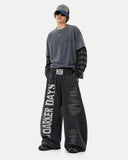 model wearing black washed barrel sweatpants streetwear outfit