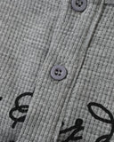 three button henley neckline detail on gray waffle t shirt