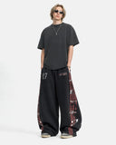 full-body outfit with black striped graphic barrel sweatpants