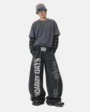 full-body outfit with black graphic barrel sweatpants